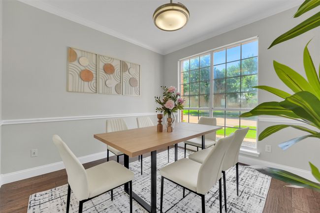 Dining room featuring crown molding and wood finished floors | Image 7