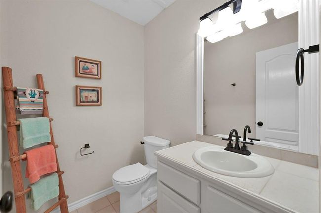 Guest half bathroom located downstairs. | Image 13