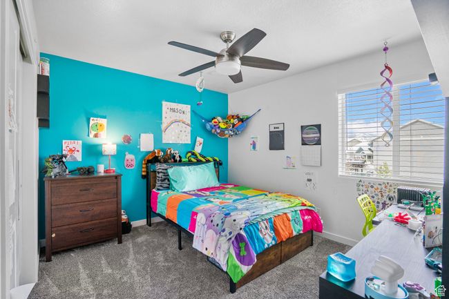 Bedroom with baseboards, carpet floors, and ceiling fan | Image 16