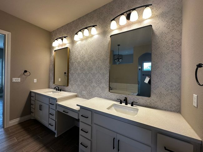 Full bathroom featuring double vanity and wood finished floors | Image 14