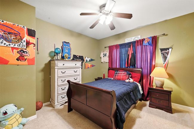 Bedroom featuring carpet and ceiling fan | Image 18