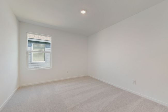 Spare room featuring light carpet and recessed lighting | Image 18