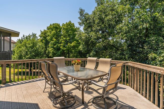 Oversized deck is perfect for entertaining with serene, lake views! | Image 53