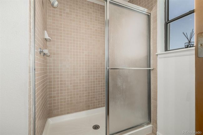 Primary bathroom with separate shower and toilet area. | Image 18