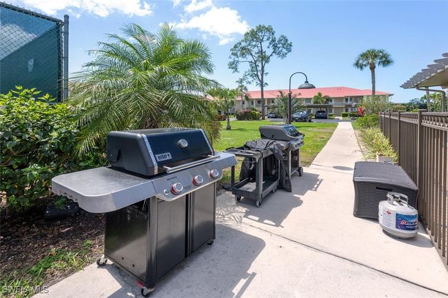 View of patio with grilling area and fence | Image 27