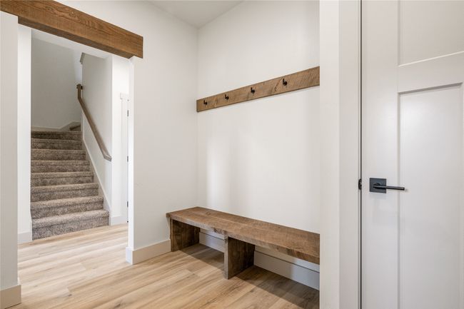 Mudroom featuring wood finished floors and baseboards | Image 21