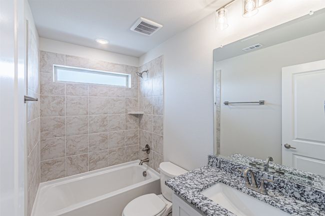 Bathroom with vanity and shower / bathtub combination | Image 34