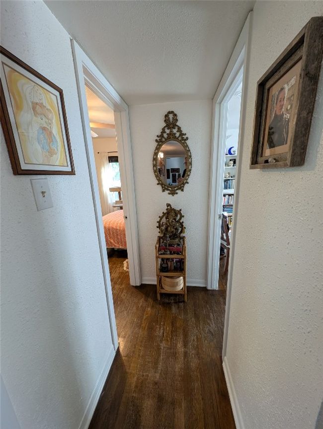 Hallway to 3 bedrooms and dark hardwood flooring | Image 10