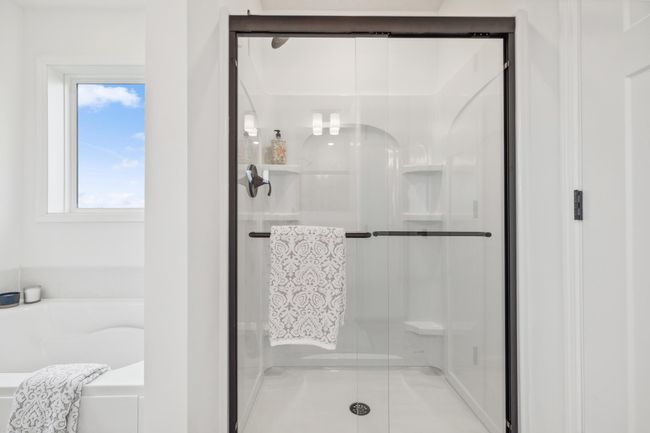 (Photo of a decorated model, actual homes finishes will vary) Another view of the primary bath. | Image 16