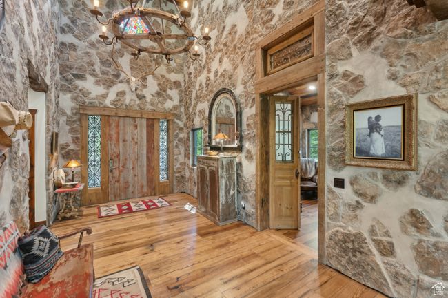 Entryway featuring a chandelier, hardwood / wood-style flooring, and healthy amount of natural light | Image 13