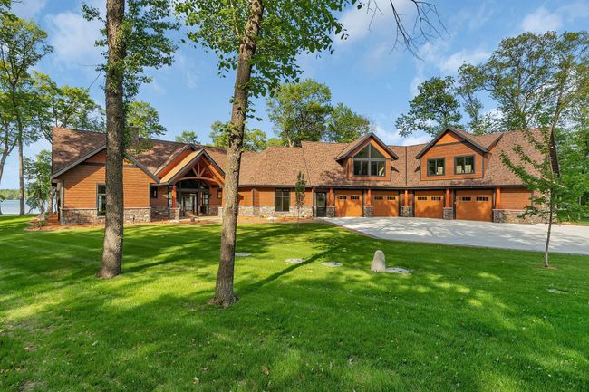 Beautifully designed home set on a meticulously manicured lawn, offering elegance, charm, and exceptional curb appeal. | Image 5