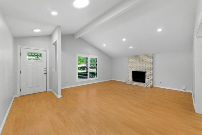 Living room with vaulted ceilings, recessed lighting and fireplace | Image 4