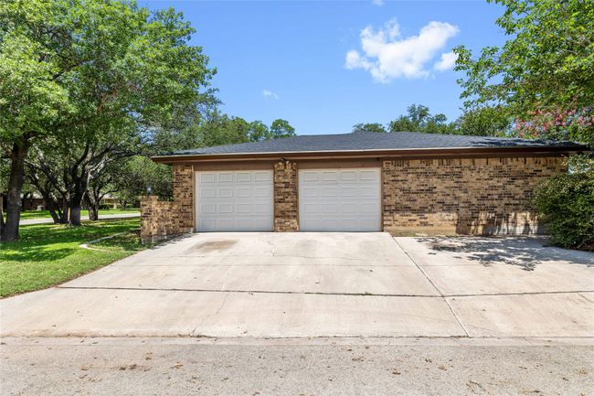 Garage with concrete driveway | Image 40