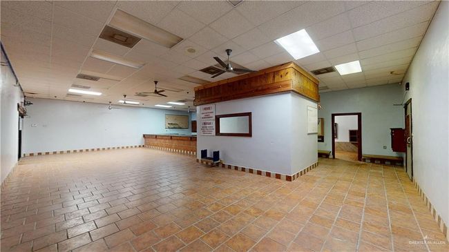 Spare room with a ceiling fan, a drop ceiling, and baseboards | Image 43