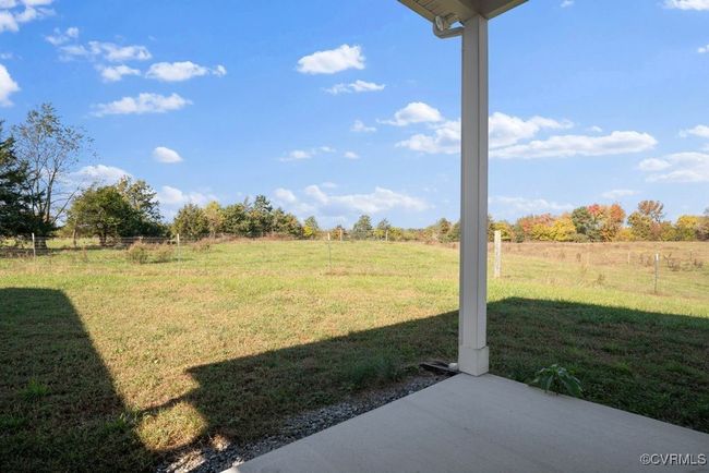 View of yard featuring a rural view and a patio | Image 47
