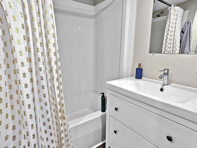 Full bathroom with shower / tub combo and vanity | Image 10