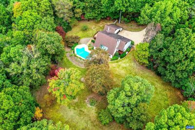 Woods surround this contemporary home giving a sense of privacy. | Image 3