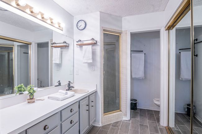 Double sink vanity, shower and mirrored wall closet. | Image 17