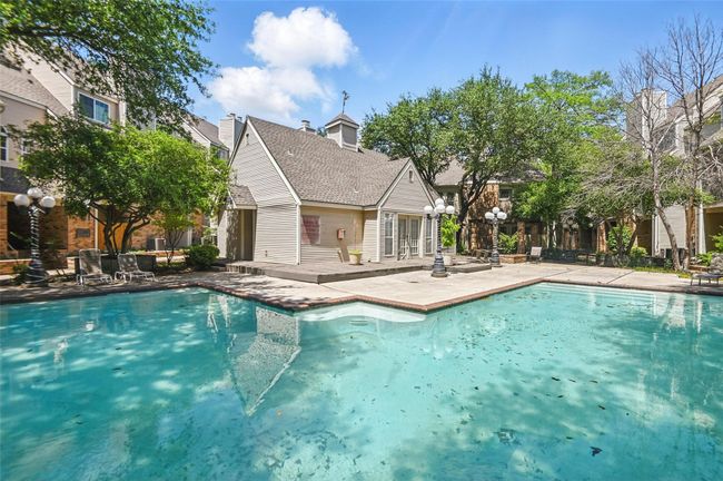 Pool with a patio area | Image 29