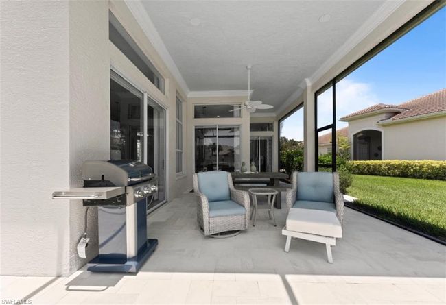 Sunroom / solarium with a ceiling fan | Image 20