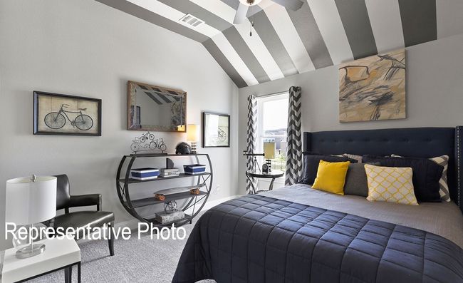 Carpeted bedroom featuring lofted ceiling and baseboards | Image 13