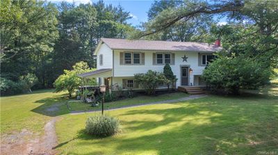 Bi-level home with a front yard | Image 1