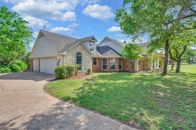 Oversized driveway, stone siding, 3 car garage | Image 30