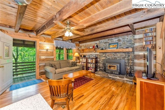 Evenings come alive around the crackling wood fire; remove the insert for a classic hearth if you wish. | Image 6
