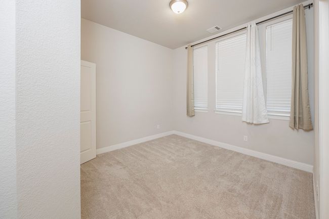 Carpeted spare room featuring baseboards | Image 7