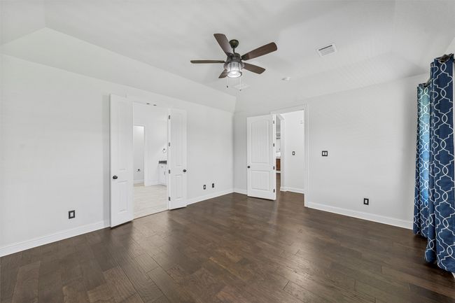 Spare room with ceiling fan and hardwood / wood-style flooring | Image 16