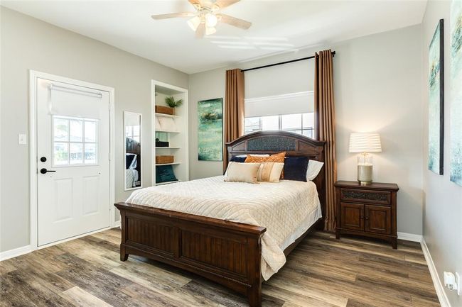 Bedroom 2 on the main level. Both bedrooms have access to the west deck | Image 23