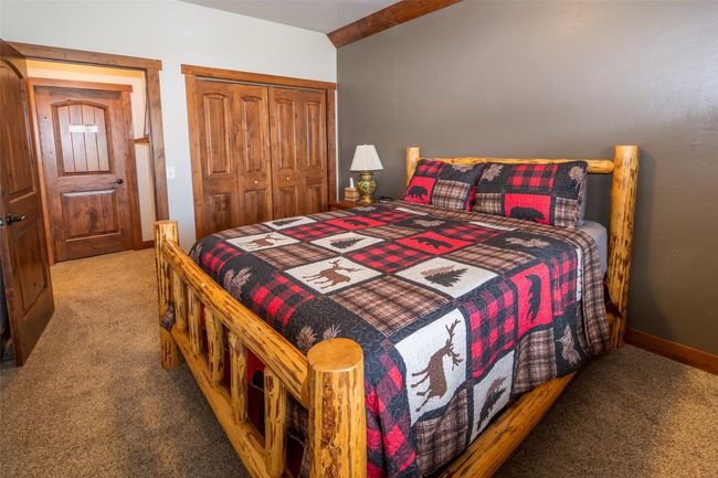 Bedroom with carpet and a closet | Image 24