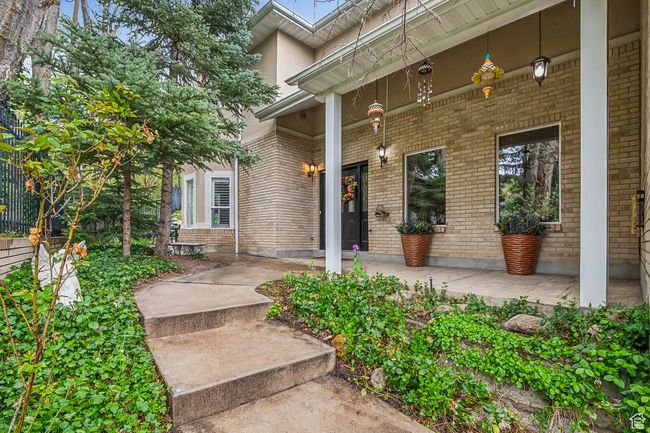 Property entrance with a porch and brick siding | Image 28