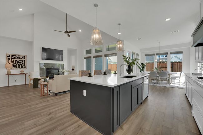 Kitchen featuring light countertops, light wood-style flooring, and visible vents | Image 10