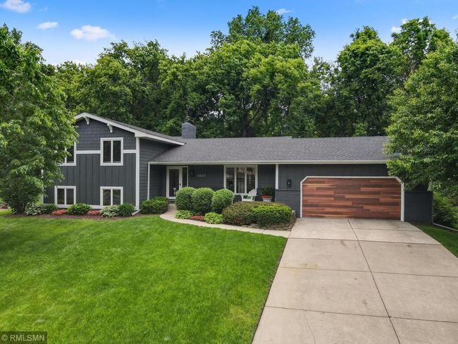 New garage door and professional landscaping | Image 46