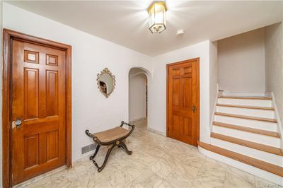 View of patio and French Doors to the Dining Room. Side view of Sunroom/Front Porch | Image 3