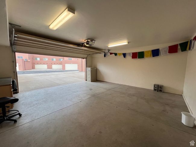 Garage with a garage door opener | Image 18