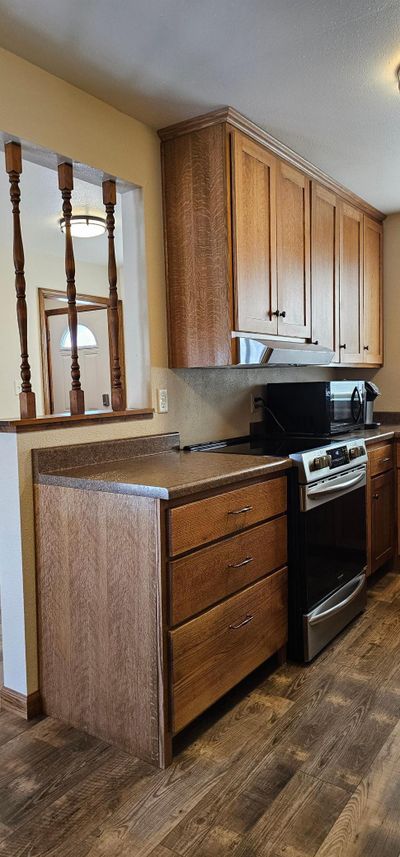 Custom made quarter sawn oak cabinets. | Image 3