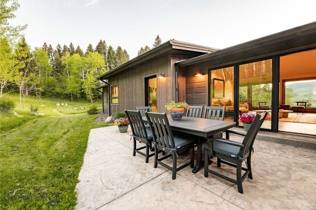 Enjoy Outdoor dining on the back patio in the midst of a nature lovers paradise. | Image 55