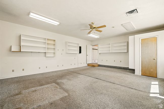 Spare room with a ceiling fan and carpet flooring | Image 38