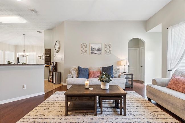 The breakfast bar is off the living room and allows for more seating. | Image 8