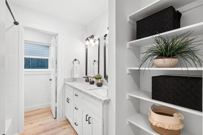 One of the secondary bathrooms with double vanity and toilet room | Image 16