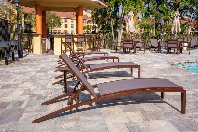 View of patio / terrace with outdoor dry bar and fence | Image 33