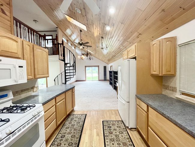 Kitchen open floorpan to the Living Room and Dining room is to the left. | Image 6