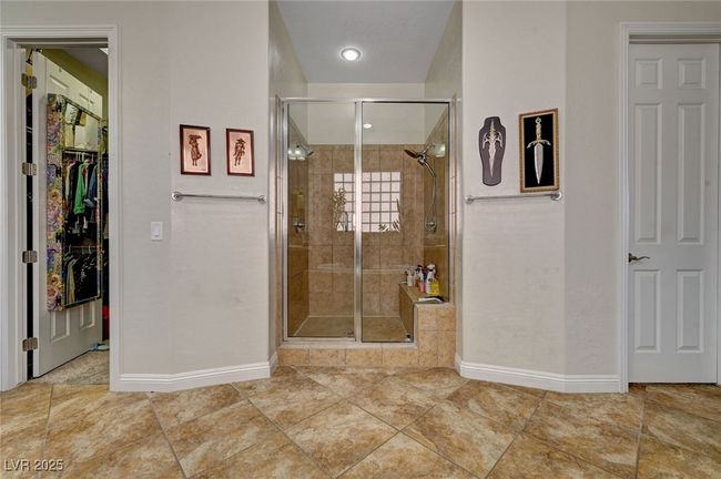 Primary shower with dual shower heads and dual walk in closets | Image 34