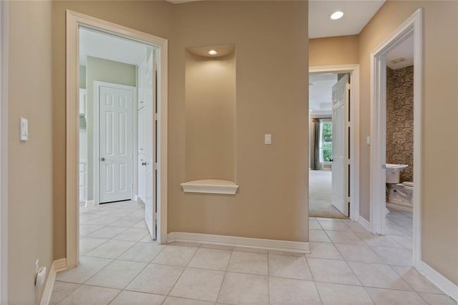 Entry into your private suite space - primary bedroom, study, laundry room and pool bath all feed off of this space. Super well thought out floor plan. | Image 18