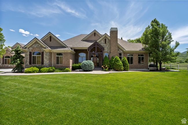 View of front of house featuring a chimney and brick siding | Image 8