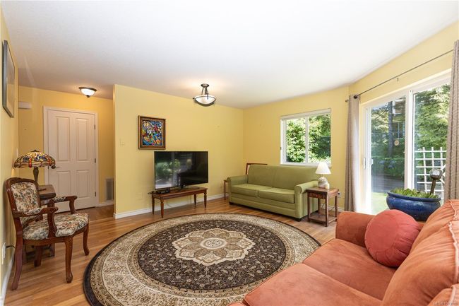 Patio door out the private garden area with nice trees and shrubs | Image 19