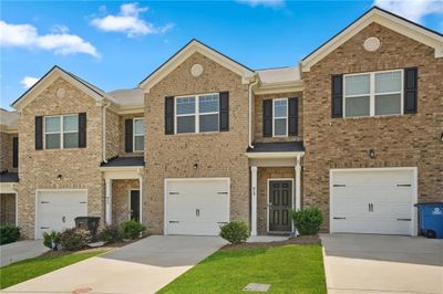 815 Taurus Drive, Townhouse with 3 bedrooms, 2 bathrooms and 2 parking in Stockbridge GA | Image 1