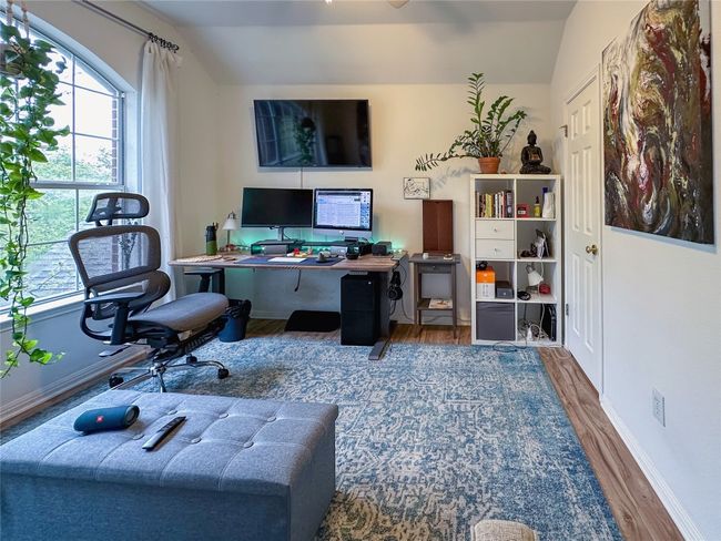 Office featuring lofted ceiling, wood finished floors, and healthy amount of natural light | Image 20